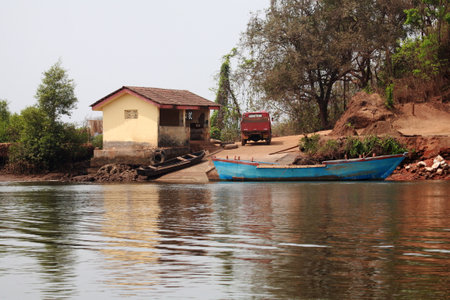 Ferry wharf and sand mining boat anchoredの写真素材