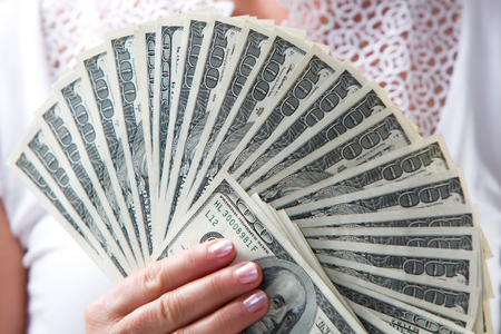 American dollars in a women hand.