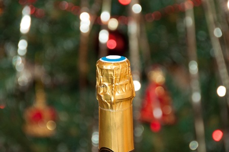 bottle of champagne and Christmas tree bokehの写真素材