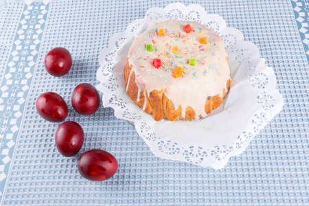 cake candied fruit and sugar powder and colored eggs