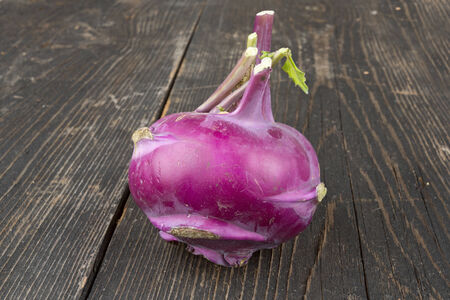 Kohlrabi cabbage on wooden tableの写真素材