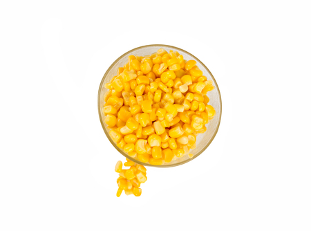 yellow corn in a glass bowl on a white background