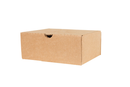 Closed shipping cardboard box isolated on white
