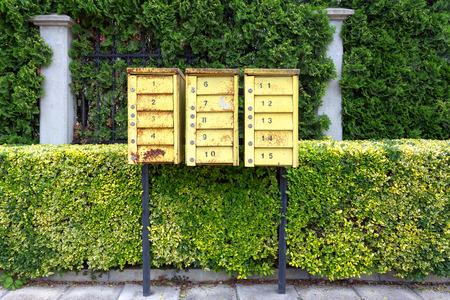 yellow mailboxes on the street
