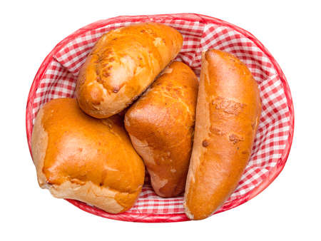 pies with cabbage in a basket on a white backgroundの写真素材