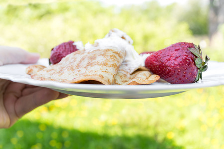 pancakes with strawberries in a plate の写真素材