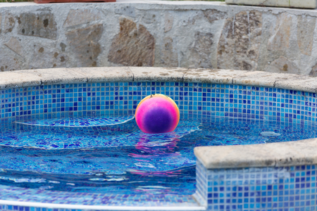 colorful ball floating in a poolの写真素材