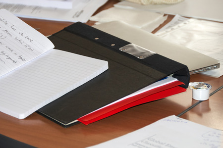 notes and folders on the tableの写真素材