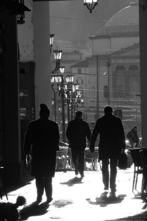 people walking in the city at morning, black and whiteの写真素材