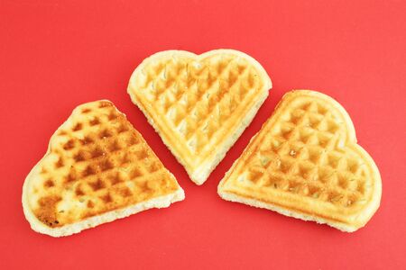 Three biscuits on a red backgroundの写真素材