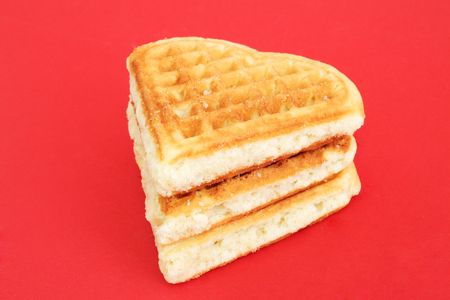 Three biscuits on a red backgroundの写真素材