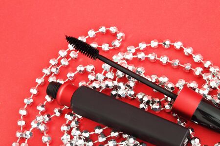 Mascara on a red backgroundの写真素材