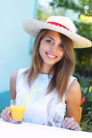 Beautiful girl drinking juiceの写真素材