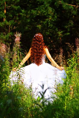 Girl in white dress in the forestの写真素材