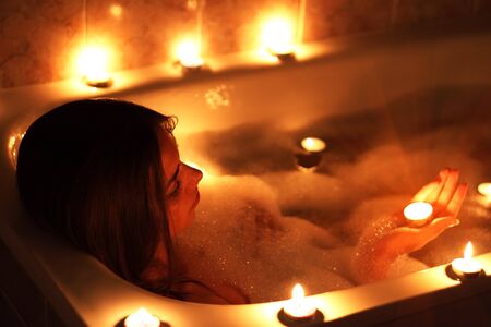 Attractive girl relaxing in her bathtubの写真素材