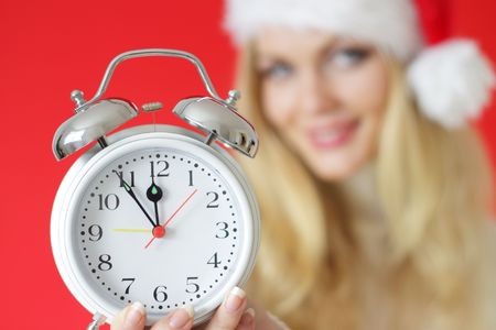 girl holding an alarm clock