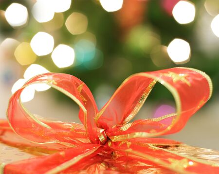 Red ribbon on a background of lights
