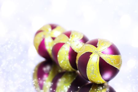 Three red Christmas ball on a background of lightsの写真素材