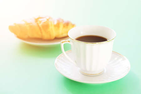 Breakfast with coffee and croissantの写真素材