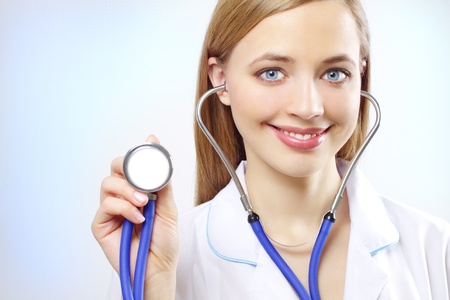 Portrait of a happy female doctor with stethoskopの写真素材
