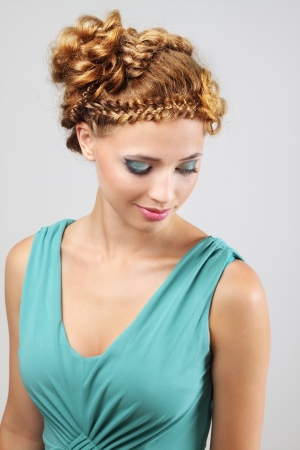Woman with beautiful hairstyle on light backgroundの写真素材