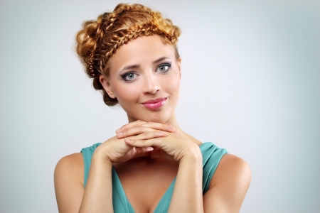 Woman with beautiful hairstyle on light backgroundの写真素材