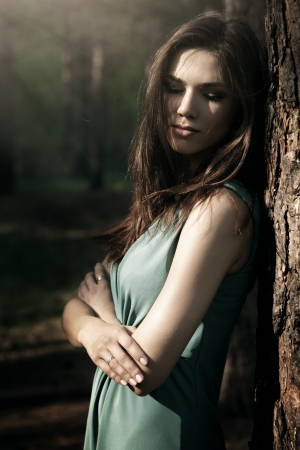 beautiful girl in fairy forest  dark backgroundの写真素材