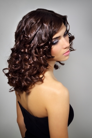 Sexy young woman with curly hairの写真素材