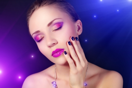 Girl with beautiful make-up on dark backgroundの写真素材