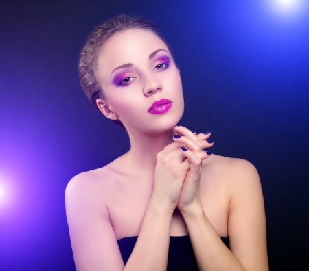 Girl with beautiful make-up on dark backgroundの写真素材