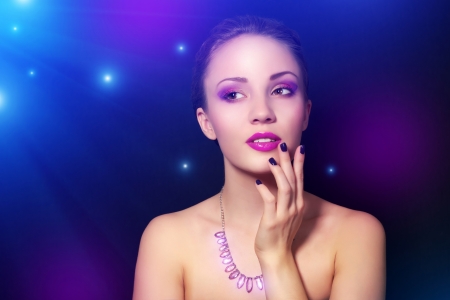 Girl with beautiful make-up on dark backgroundの写真素材