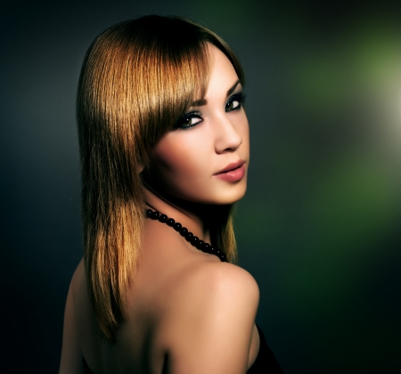 Sensual girl with beautiful makeup on black backgroundの写真素材