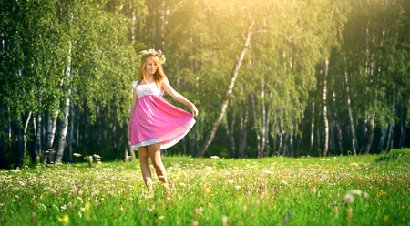 Young attractive girl on a green meadowの写真素材