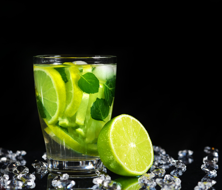 Mojito cocktail with fresh limes on a black backgroundの写真素材