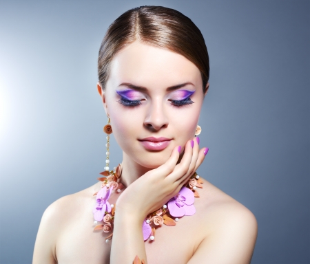 Girl with beautiful make-up on dark backgroundの写真素材
