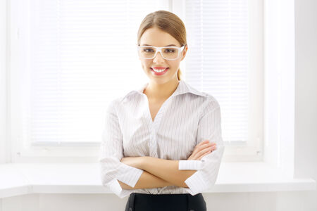 Young business woman on  light backgroundの写真素材