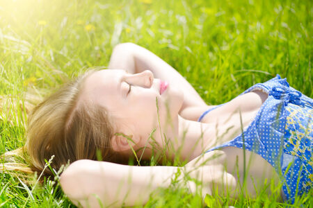Sleeping Girl. Beautiful young girl outdoor. light backgroundの写真素材