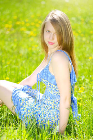 Beautiful young girl outdoor. light backgroundの写真素材