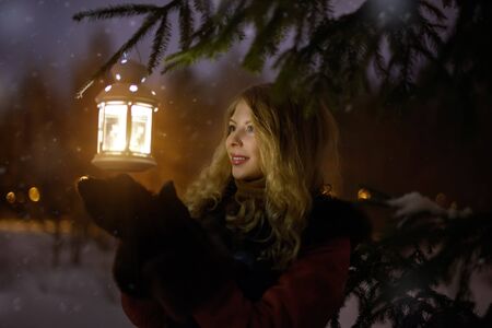 Cute girl with a lantern. Christmas girl with lantern