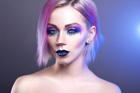 Beauty fashion model girl with colorful dyed hair. light backgroundの写真素材