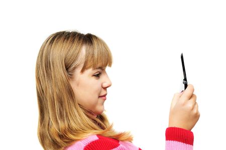  happy and surprised teenager girl looking on mobile phoneの写真素材