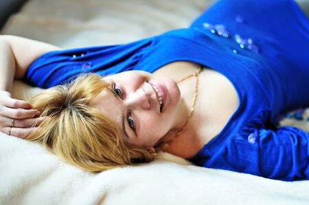 attractive forty years  woman  laying on the bedの写真素材