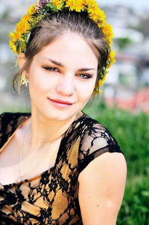 portrait of teen girl with dandelion garland の写真素材