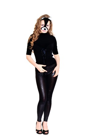 cat-woman with long curly hair standing over the whiteの写真素材