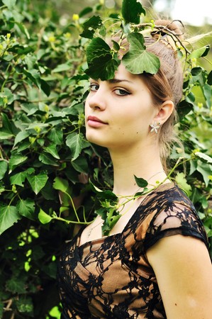 forest awesome  nymph - beautiful girl in the green leaves の写真素材