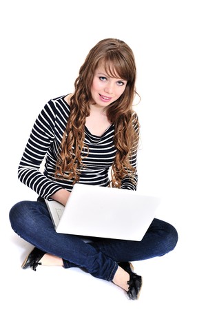 pretty student girl with laptop over the white の写真素材