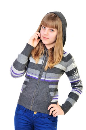 teen girl talking by mobile phone over the whiteの写真素材