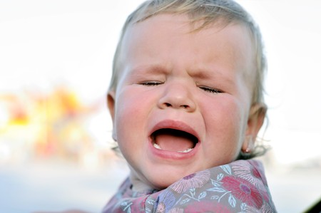 portrait of crying baby girl with sad faceの写真素材