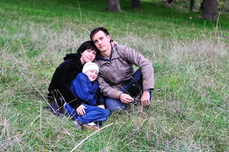 happy family in forest in early autumnの写真素材
