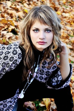 portrait of pretty teen girl in autumn parkの写真素材